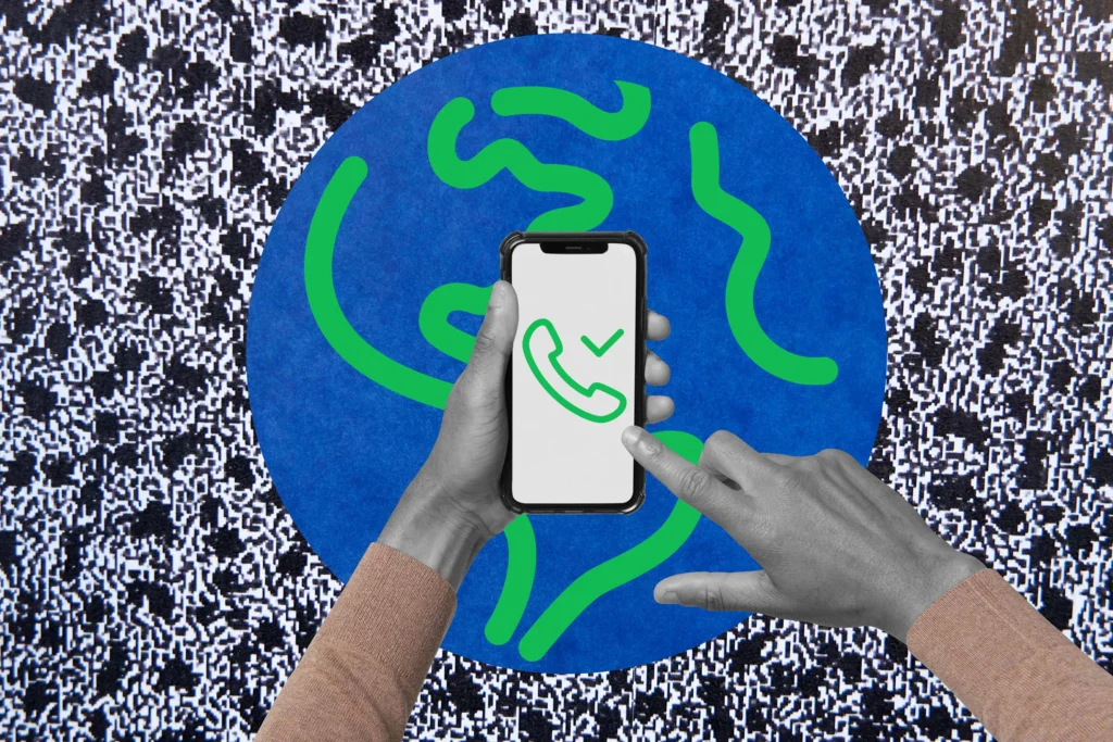 Hand holding phone with a phone icon inside