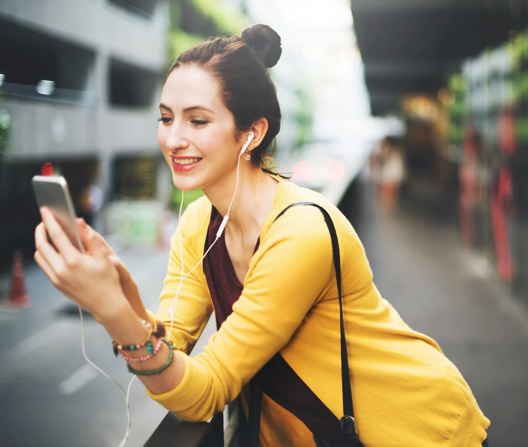 Woman smiling at her phone